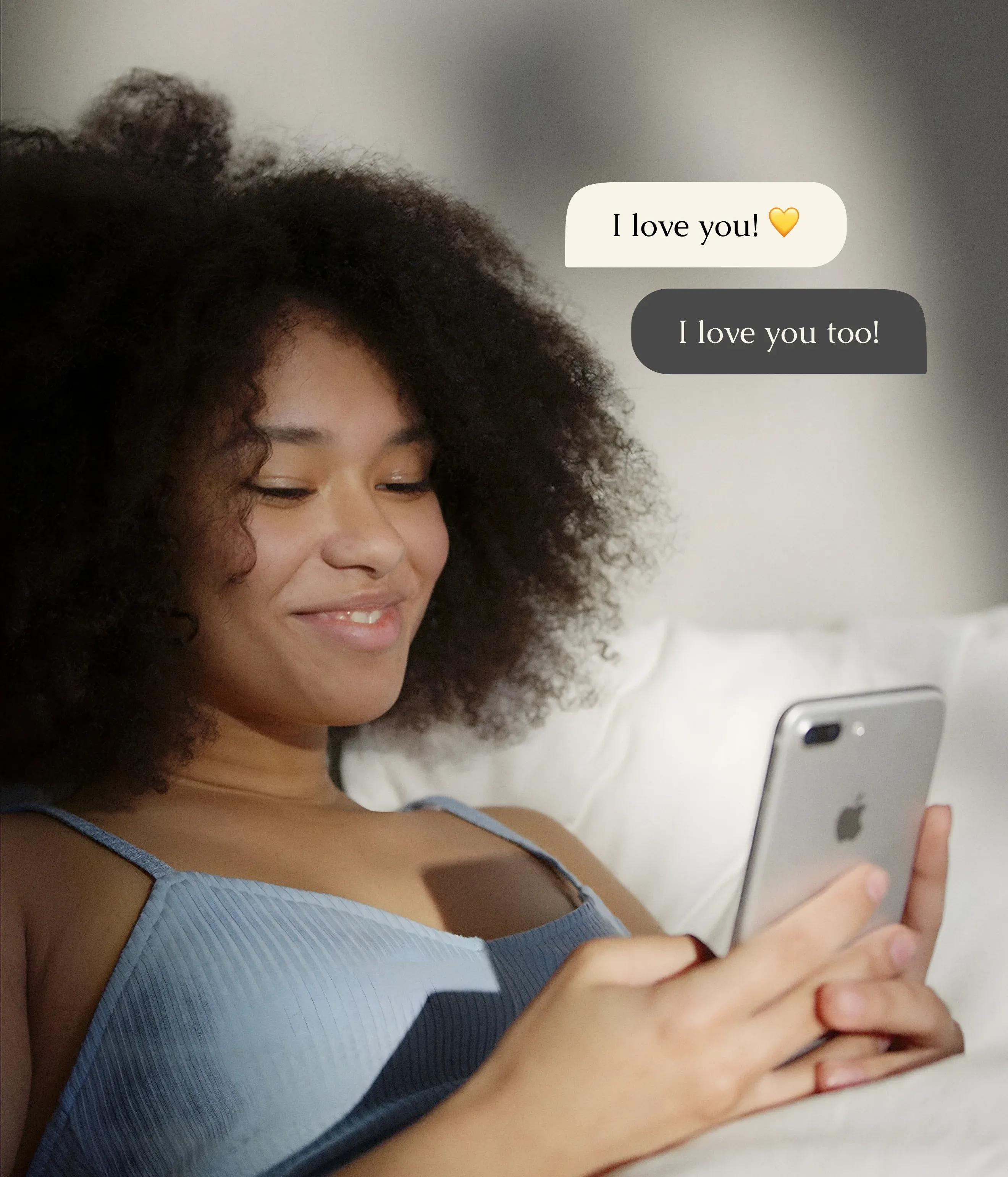 Woman is texting on a mobile phone using Just Between Us application